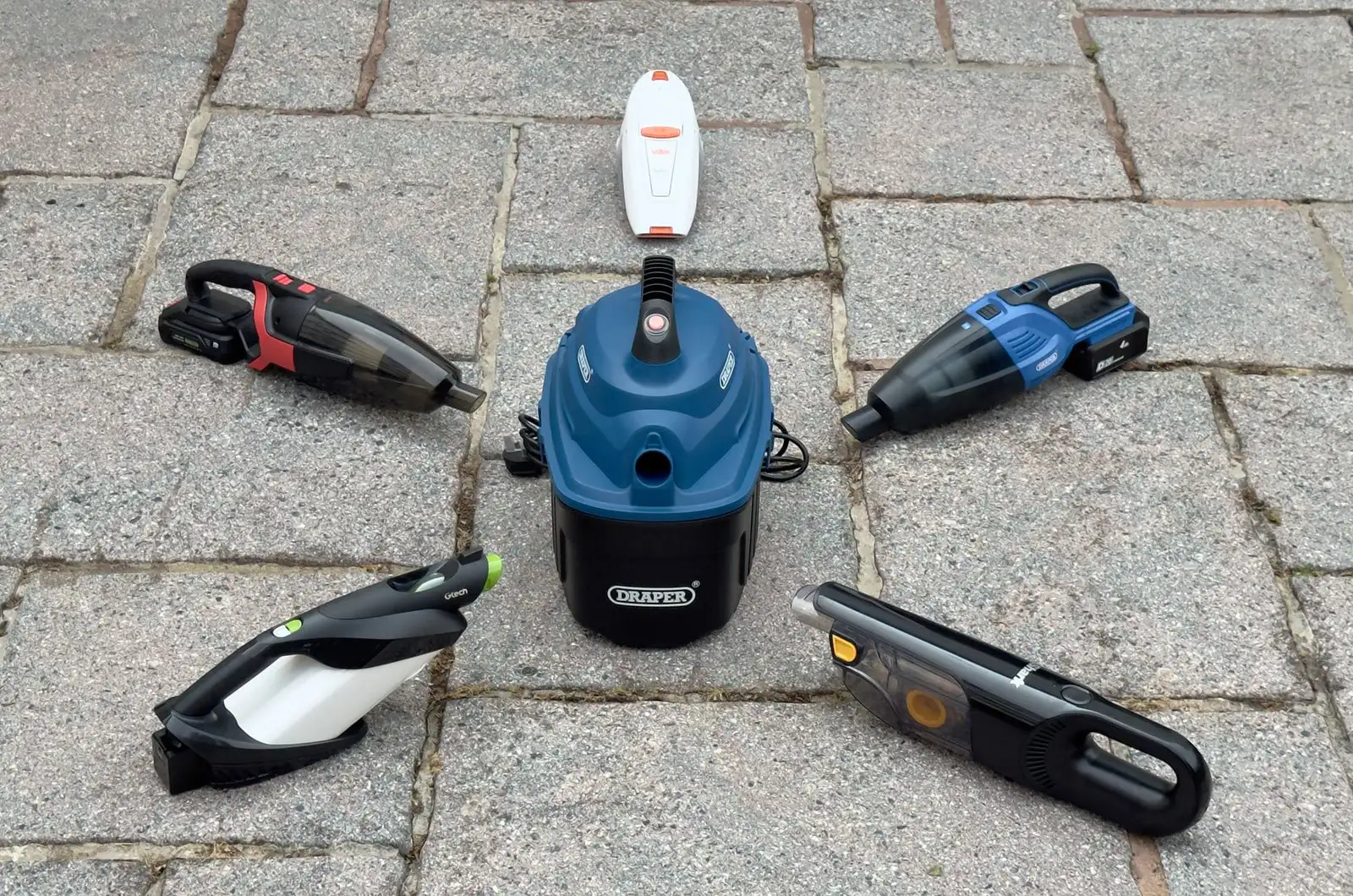 Cordless car vacuum being used on vehicle interior