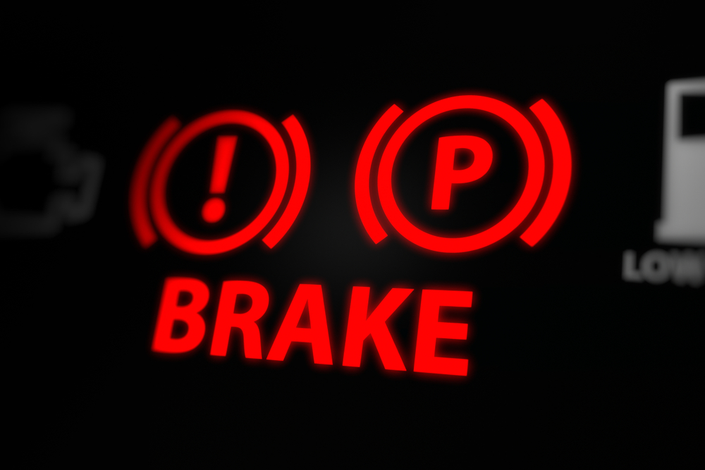 Close-up of worn brake pads on a vehicle