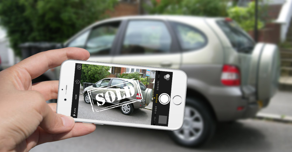 Car keys being handed over during sale
